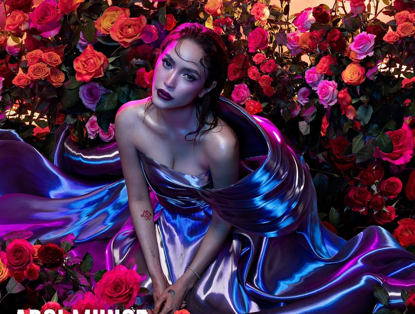 Arci Muñoz on the cover of Victor Magazine wearing a metallic blue gown surrounded by roses styled by Houz of Zen