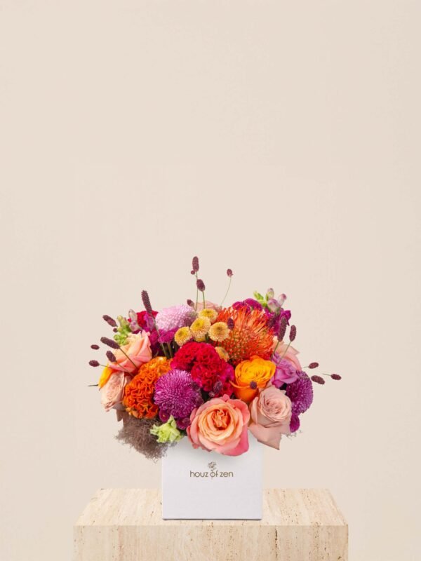 Fall flower box Dubai with roses, celosia, chrysanthemums, and leucospermum in a white Houz of Zen box.
