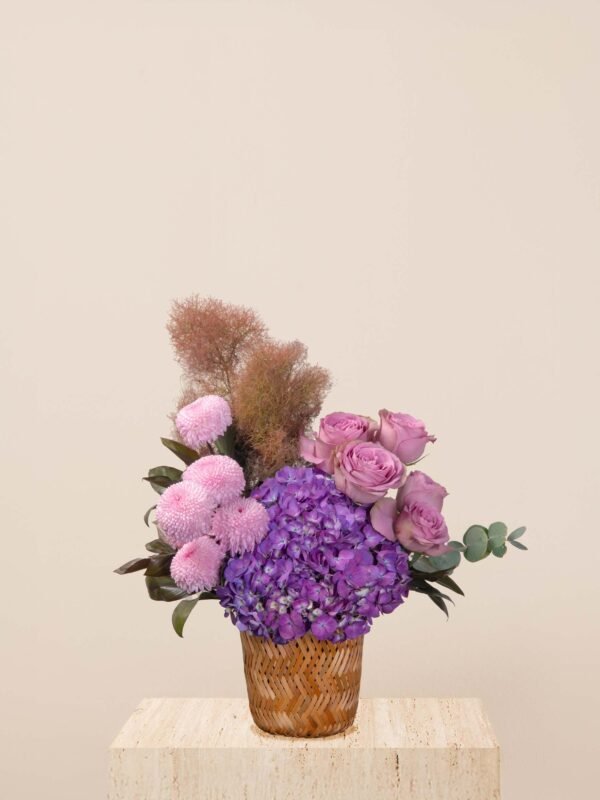 Purple flower basket Dubai with chrysanthemums, hydrangeas, and lavender roses.