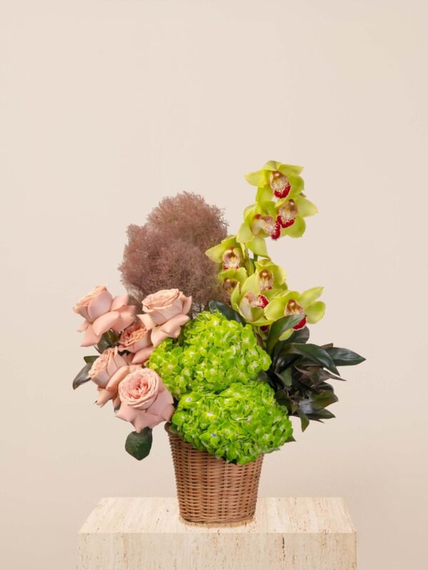Green flower basket Dubai with cappuccino roses, hydrangeas, cymbidium orchids, and cotinus.