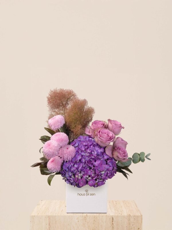 Luxury violet flower box with purple hydrangeas, lavender roses, and pink chrysanthemum pingpong in a white Houz of Zen box