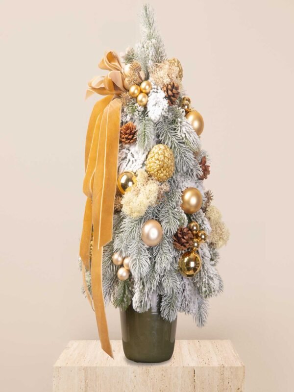 Frosted gold mini tree with faux snowy branches, gold ornaments, pinecones, botanical textures, and a velvet ribbon.