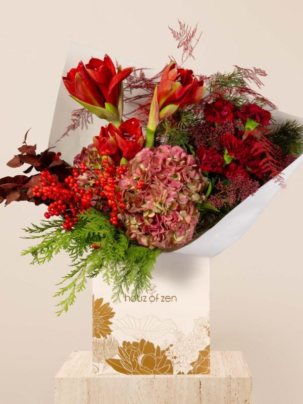 Ruby festive flower bouquet with red amaryllis, hydrangea, berries, and winter foliage arranged in a Houz of Zen box.