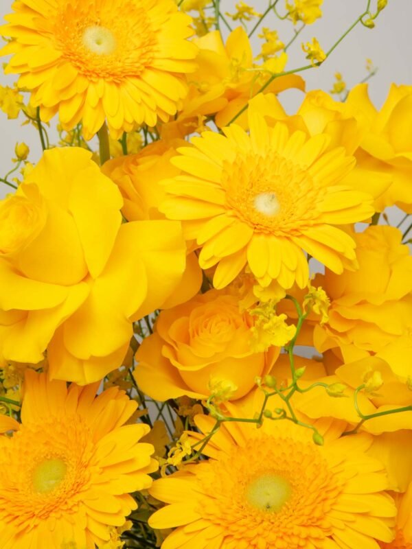 Yellow roses and gerberas close-up from ZEN Saffron Air vase arrangement in Dubai
